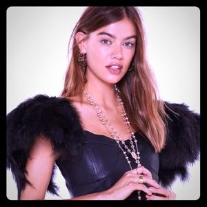 🦚Faux Leather Mini w/Feathers 🦚